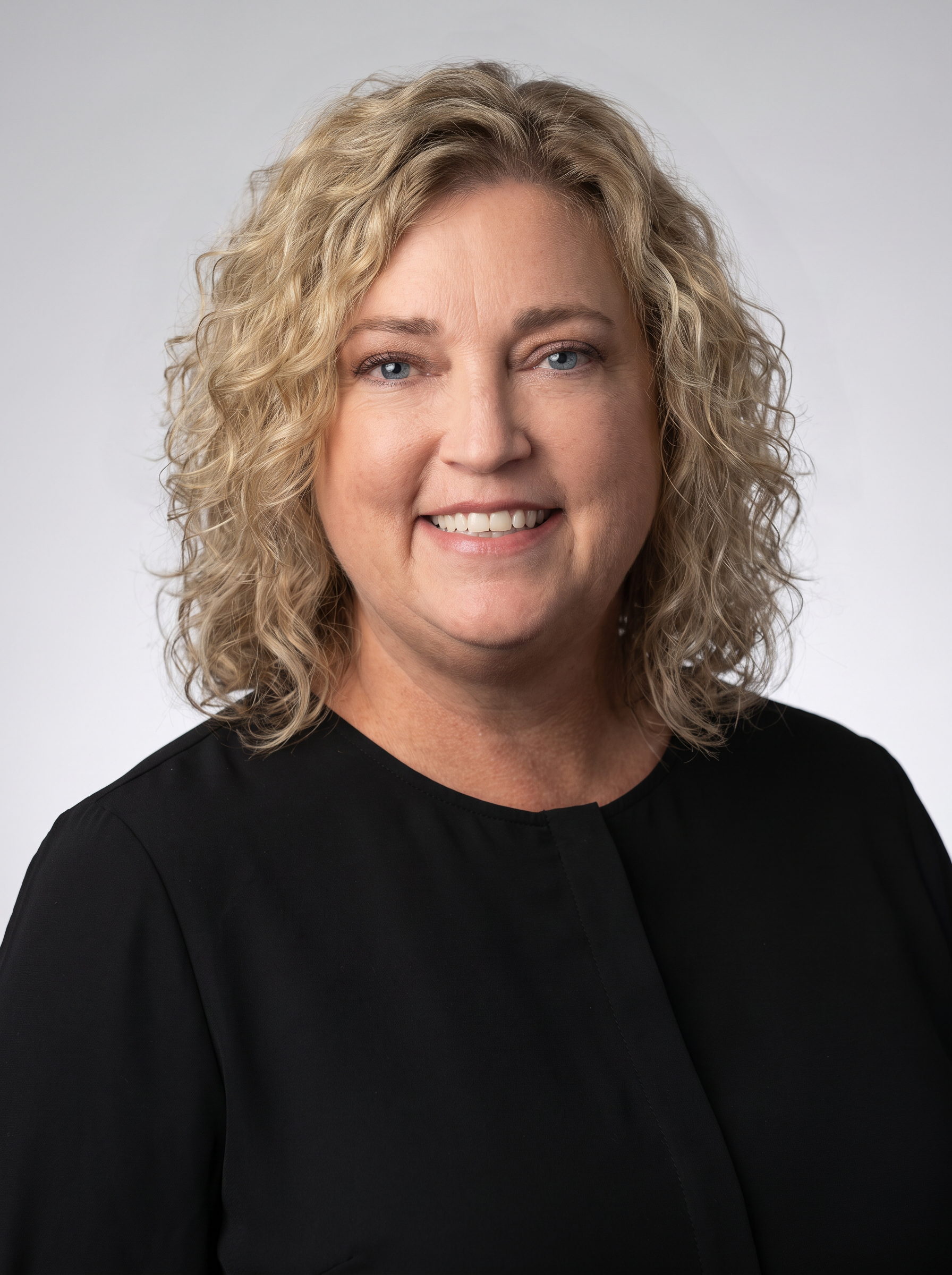 Create_a_premium_corporate_headshot_of_this_exact_-1786637334857